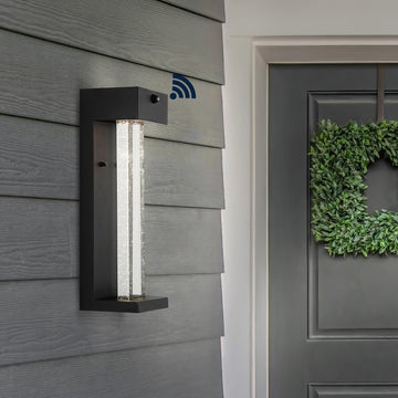 Miranda 5.13" Modern Industrial Iron/Glass Seeded Glass with Dusk-to-Dawn Sensor Integrated LED Outdoor Sconce - JONATHAN Y